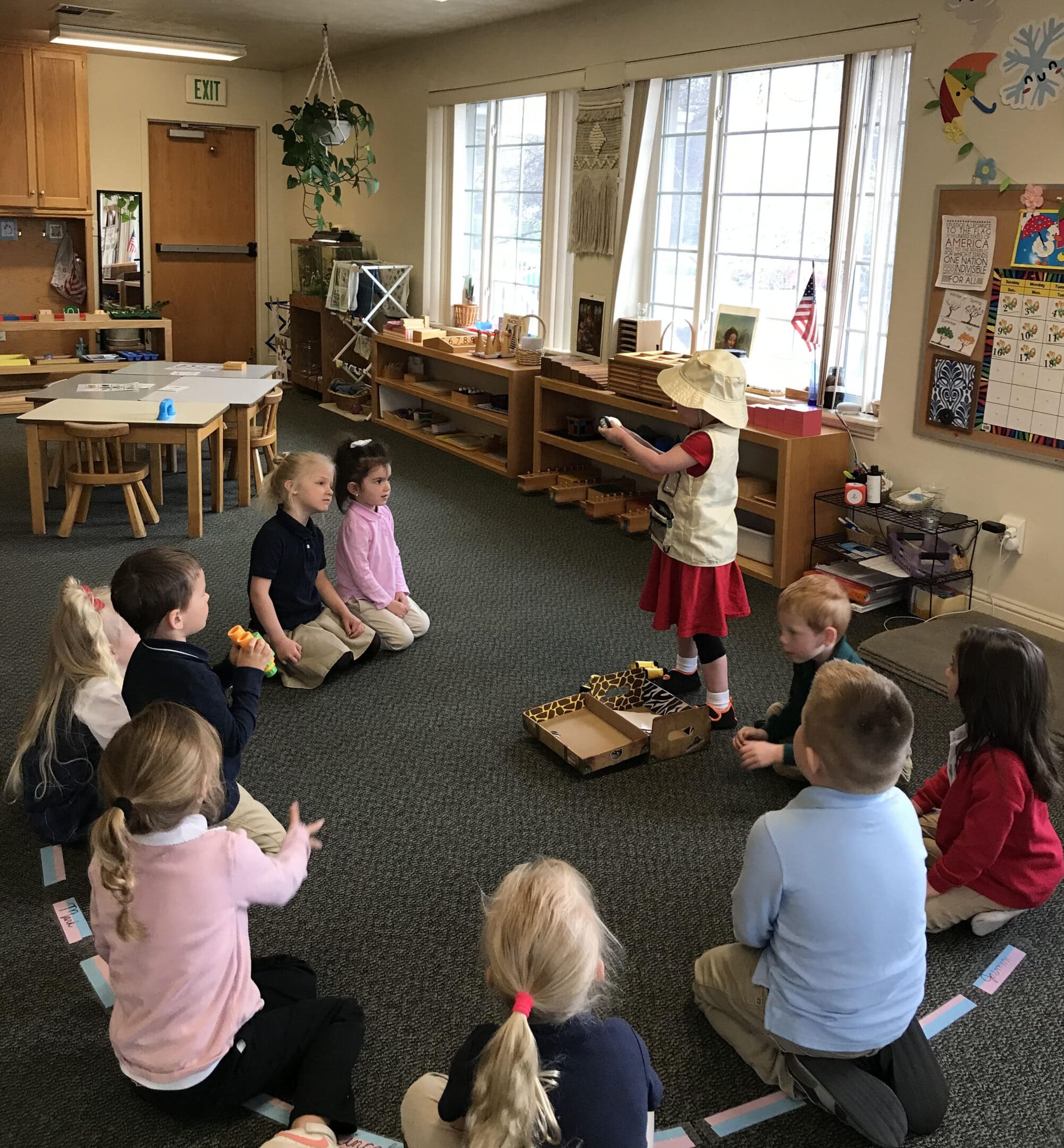 A group of children sitting in the floor playing with toys.