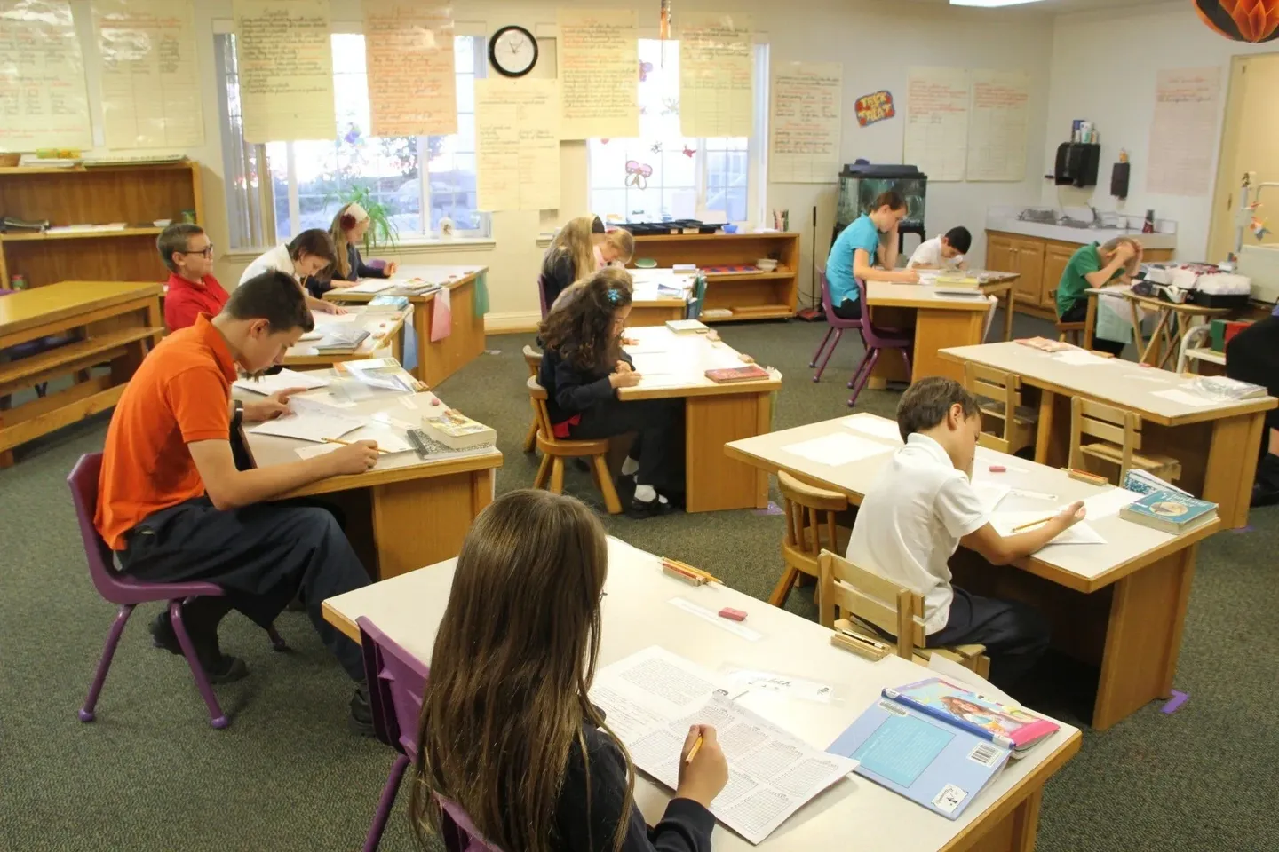 A group of students sitting at desks in a classroom.